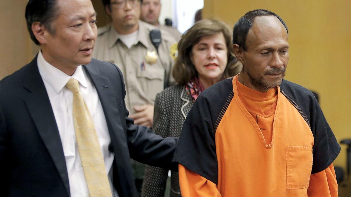 Jose Ines Garcia Zarate, right, is led into the courtroom by San Francisco Public Defender Jeff Adachi in July 2015 for arraignment.