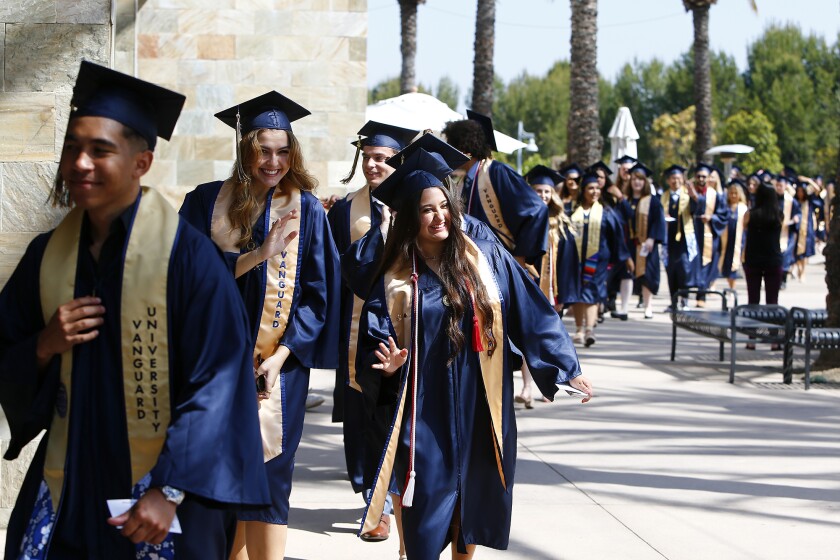 Undergraduates head to Mariners Church in Irvine on Thursday for Vanguard University's Class of 2022 commencement ceremony.