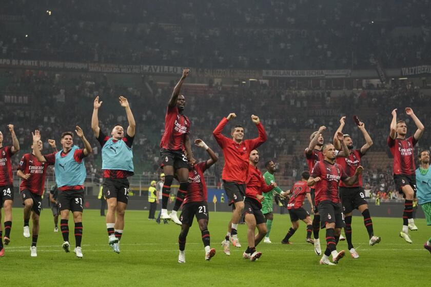 AC Milan players celebrate their 2-0 win at the end of a Serie A soccer match between AC Milan and Lazio, at the San Siro stadium in Milan, Italy, Saturday, Sept. 30, 2023. (AP Photo/Luca Bruno)