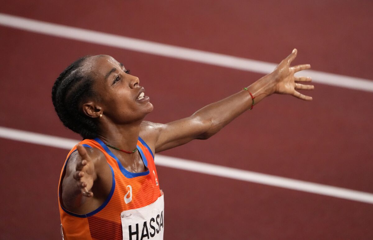 Sifan Hassan, of Netherlands celebrates after winning the gold medal in the final of the women's 5,000-meters at the 2020 Summer Olympics, Monday, Aug. 2, 2021, in Tokyo, Japan. (AP Photo/Charlie Riedel)