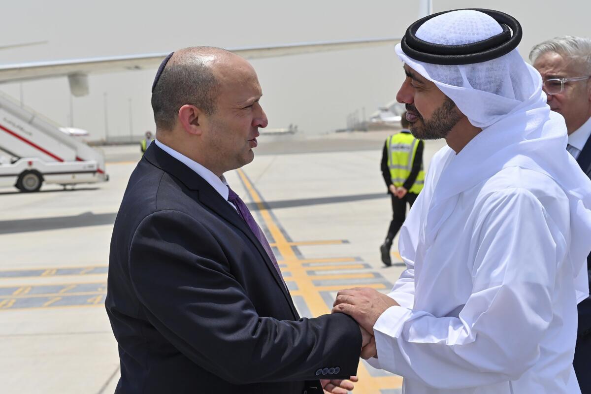 President of the United Arab Emirates Sheikh Mohammed Bin Zayed greets Israeli Prime Minister Naftali Bennett on his arrival to Abu Dhabi, United Arab Emirates, Thursday, June 9, 2022. The visit was Bennett's second public trip to Abu Dhabi since Israel and the UAE agreed to normalize ties in 2020 after years of quiet cooperation, mainly over their shared concerns over Iran's nuclear capabilities. (Israeli Government Press Office via AP)