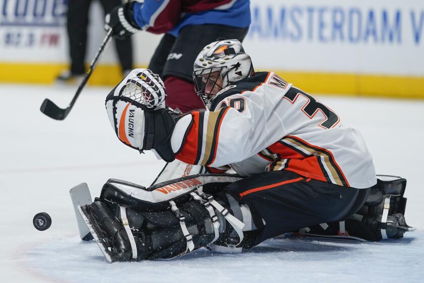 Anaheim Ducks goaltender Ryan Miller makes a save against the Colorado Avalanche during the third period of an NHL hockey game, Saturday, Oct. 26, 2019, in Denver. (AP Photo/Jack Dempsey)
