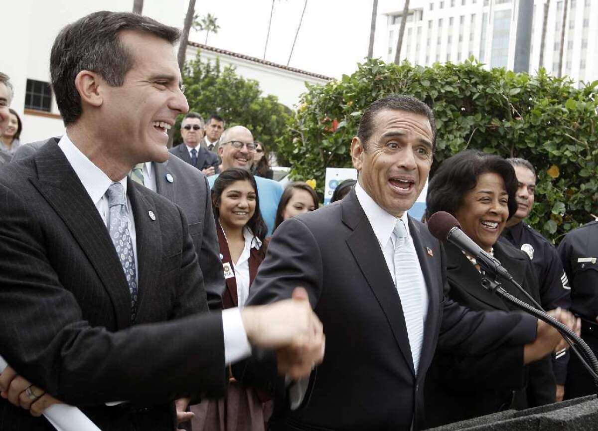 Eric Garcetti and L.A. Mayor Antonio Villaraigosa at an event at Union Station in 2011.