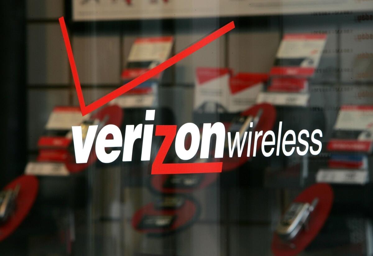 The Verizon logo is seen at a Verizon Wireless store in San Francisco.