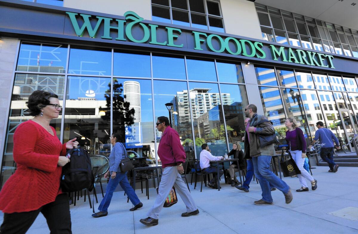 At Whole Foods, co-CEO Walter Robb has $613,836 banked up due to 2,703 accrued time-off hours he hasn’t used in his 24 years at the company. Above, a Whole Foods Market in downtown Los Angeles.