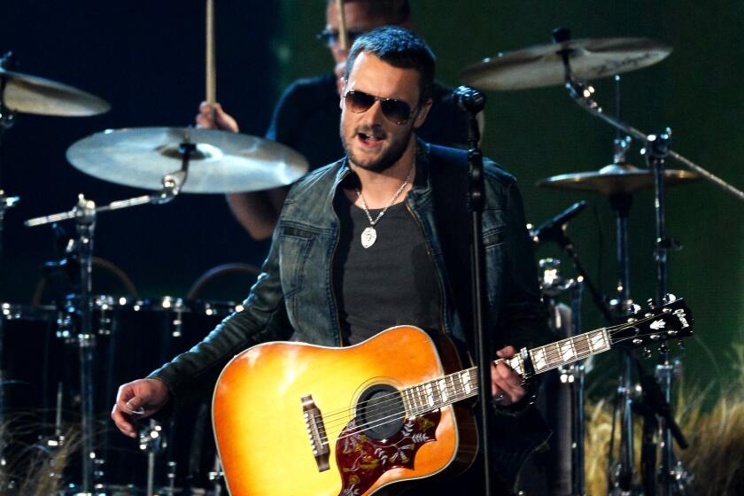 Eric Church, seen performing Sunday at the Academy of Country Music Awards, announced Wednesday that he'll tour North America this fall with Dwight Yoakam.