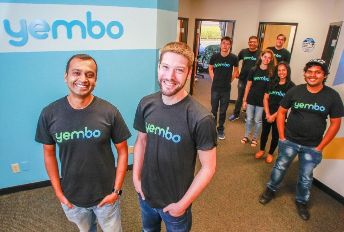Yembo co-founders Siddharth Mohan (left) and Zach Rattner, with team.