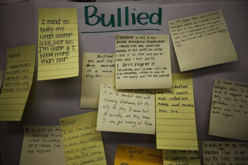 Teens who were bullied at age 13 were more likely to be depressed as adults, according to a new study. The findings suggest that curbing bullying in schools will improve public health years later. Above, high school students write notes acknowledging their own bullying behavior.