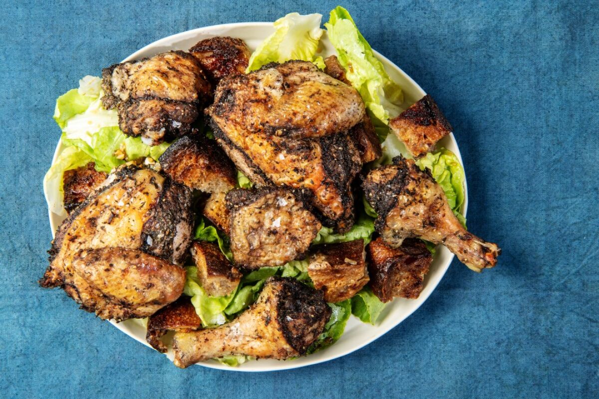 A spin on the famous Zuni Cafe chicken and bread salad, spiced with classic jerk seasonings