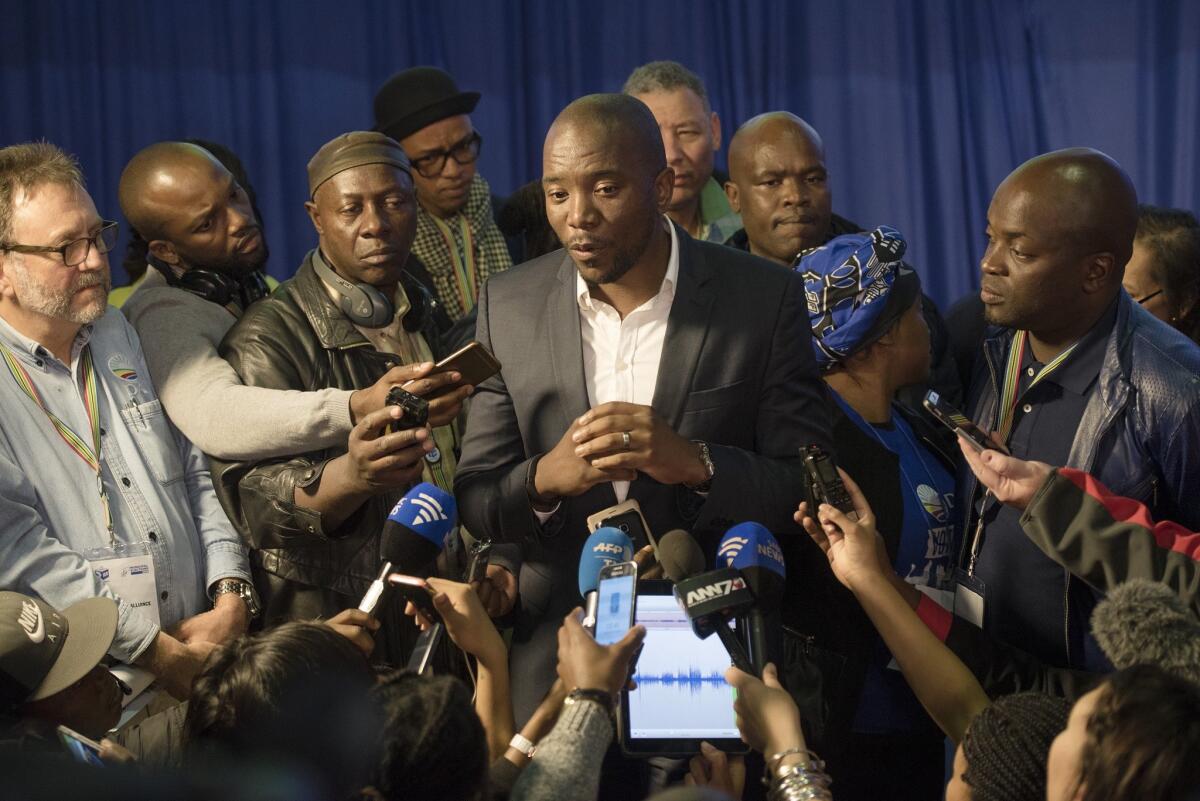 Mmusi Maimane, leader of the official opposition Democratic Alliance, talks to the press at the election results center in Pretoria, South Africa