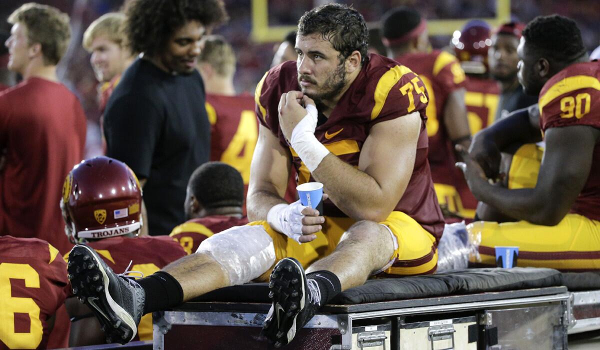 Former USC offensive lineman Max Tuerk watches from the sideline against Washington.
