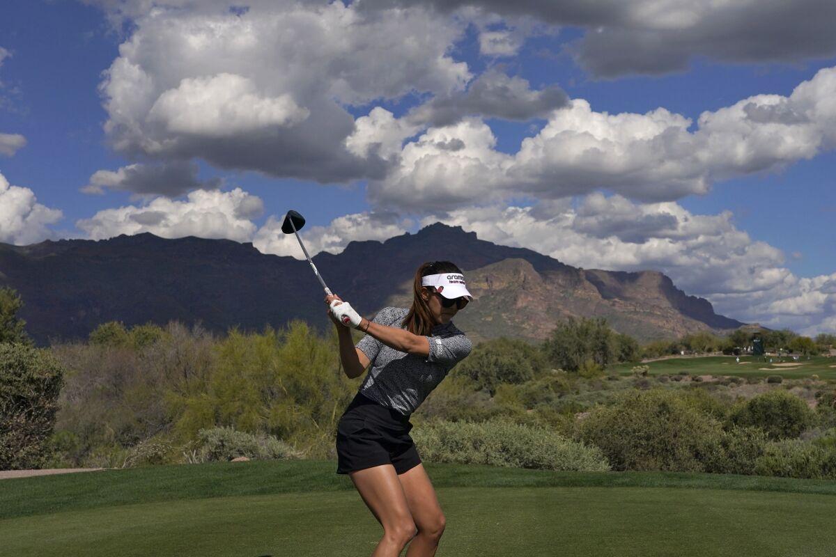 Alison Lee hits from the 15th tee during the first round of the Drive On Championship golf tournament, Thursday, March 23, 2023, in Gold Canyon, Ariz. (AP Photo/Matt York)