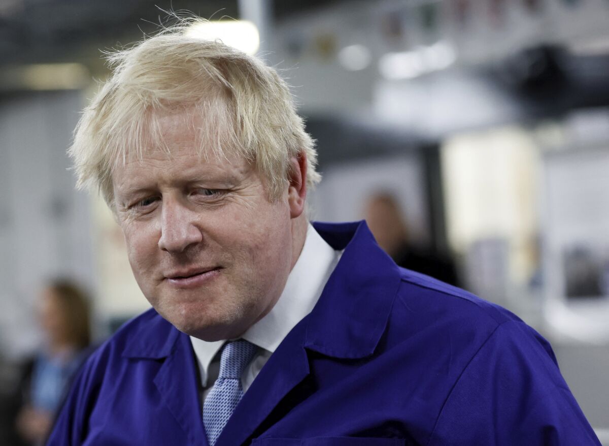 British Prime Minister Boris Johnson visits the technology centre at Hopwood Hall College, in Middleton, Greater Manchester, England, Thursday Feb. 3, 2022. (Jason Cairnduff/Pool via AP)