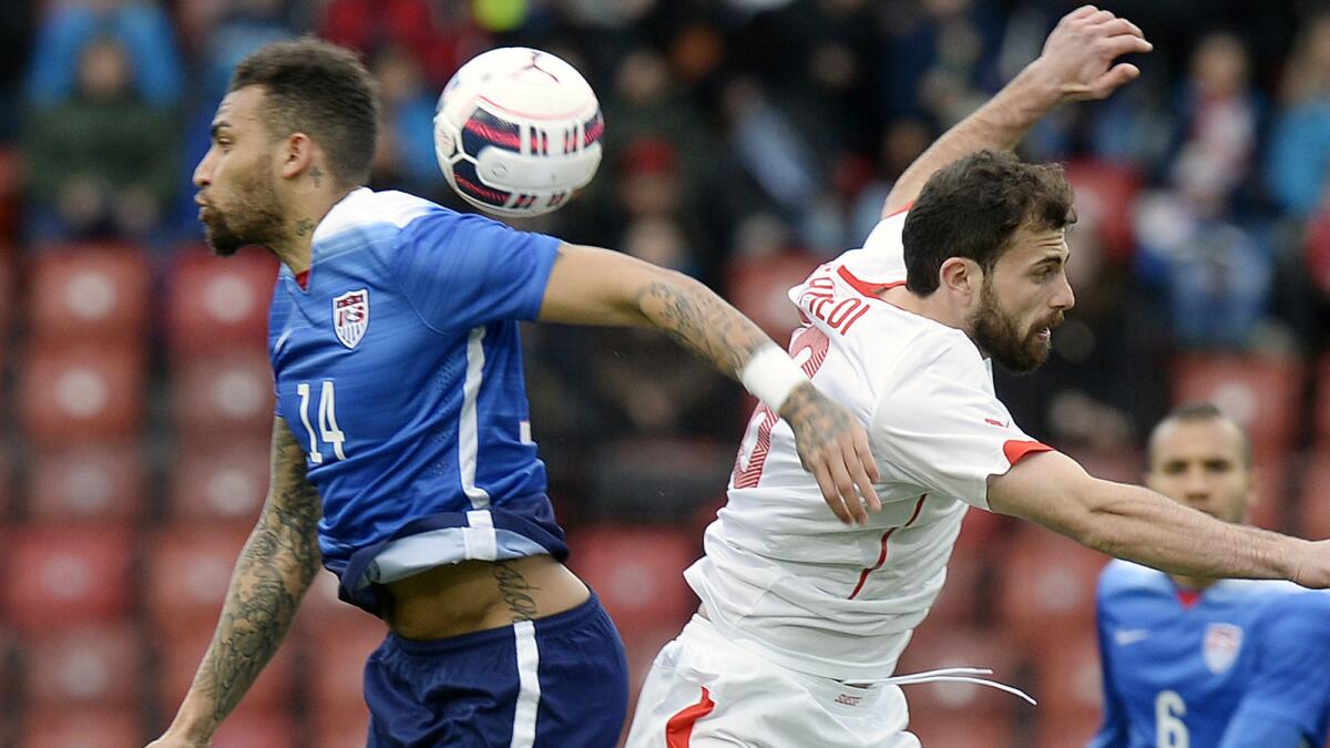 U.S. midfielder Danny Williams, left, challenges Switzerland forward Admir Mehmedi for the ball during a 1-1 draw in an international friendly match on Tuesday.