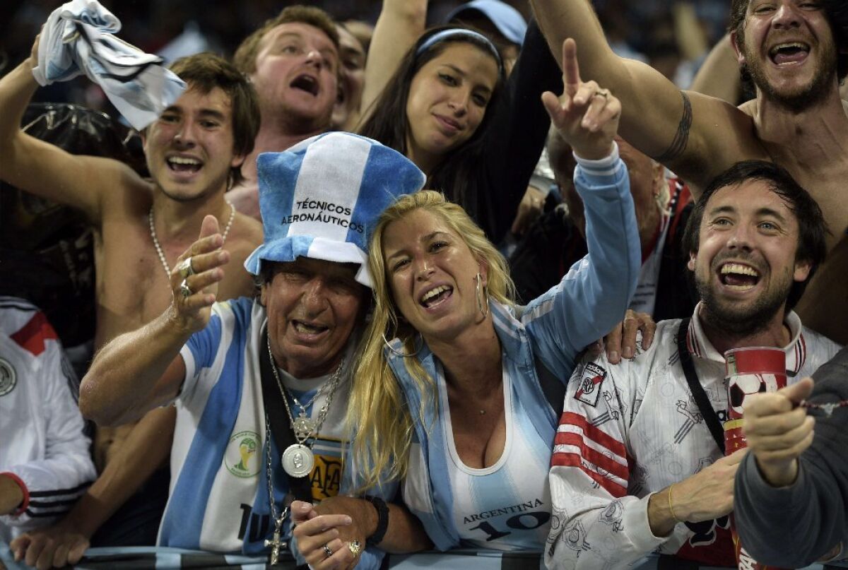 Fans support Argentina during the 2014 FIFA World Cup. A new study says that holding the 2022 tournament in Doha, Qatar, in the summer would be unbearable for most spectators.