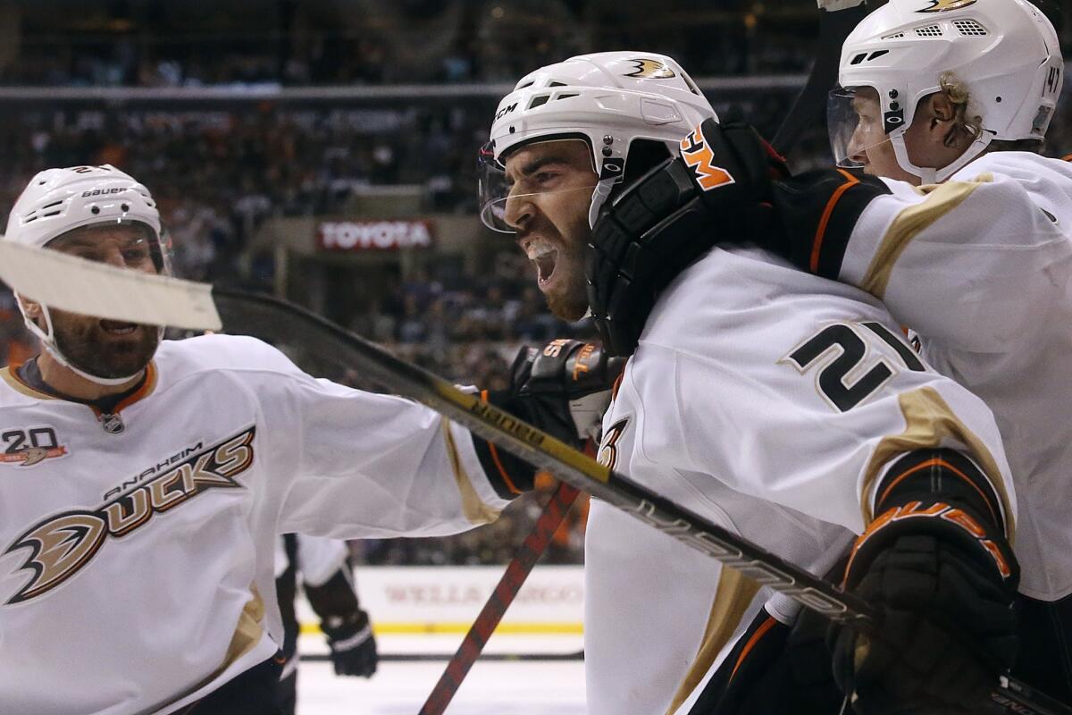 Ducks winger Kyle Palmieri celebrates with teammates after scoring against the Kings in the second period of Game 6. The Kings beats the Ducks, 2-1.