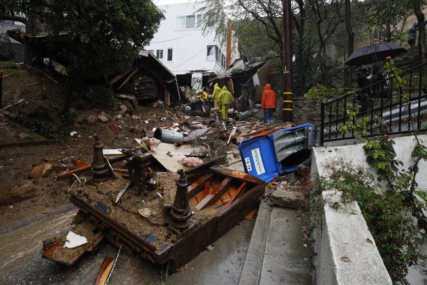 LOS ANGELES CA FEBRUARY 5, 2024 - Mud and debris block portions of the 10000 block of Caribou Lane, where a mudslide destroyed a home on Monday, Feb. 5, 2024, in the Beverly Crest area of Los Angeles. A storm of historic proportions unleashed record levels of rain over parts of Los Angeles on Monday, endangering the city's large homeless population, sending mud and boulders down hillsides dotted with multimillion-dollar homes and knocking out power for more than a million people in California. (Allen J. Schaben / Los Angeles Times) (Allen J. Schaben / Los Angeles Times)