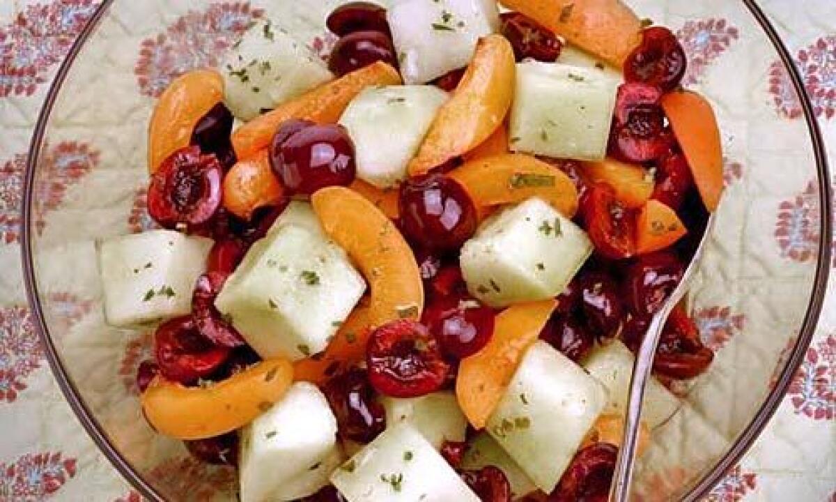 FRESHEN UP: Basil and a hint of white wine jazz up a cherry, apricot and honeydew salad.