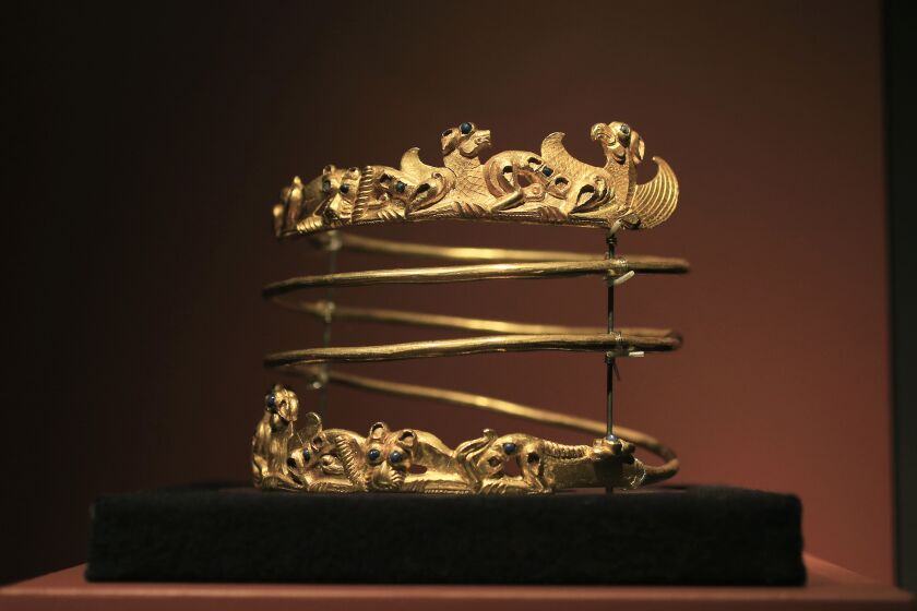 FILE - A spiraling torque from the second century A.D., is displayed as part of the exhibit called The Crimea - Gold and Secrets of the Black Sea, at Allard Pierson historical museum in Amsterdam, on April 4, 2014. The Supreme Court of the Netherlands on Friday June 9, 2023 ordered a trove of historical treasures from Crimea, stored for years at a Dutch museum, to be sent to Ukraine, upholding a lower court ruling that the 300 artifacts were part of Ukraine’s cultural heritage. (AP Photo/Peter Dejong, File)