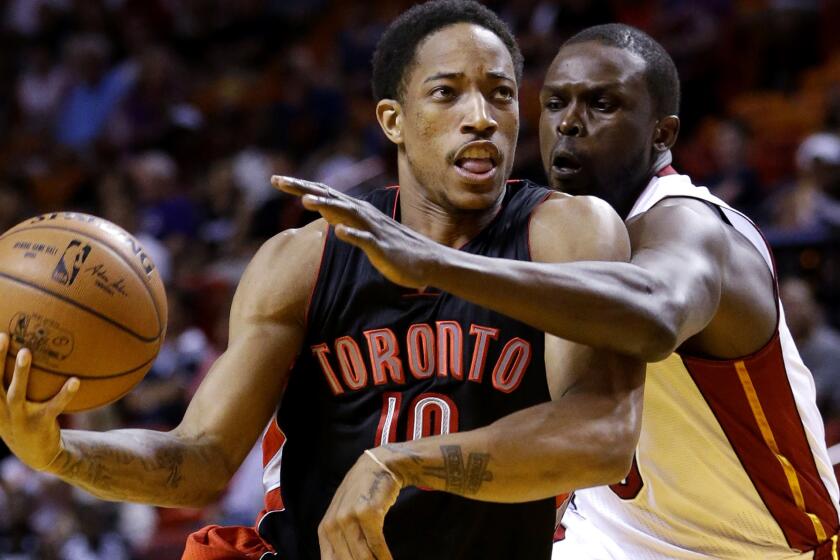 Raptors guard DeMar DeRozan (10) drives to the basket against Heat forward Luol Deng during the second half Saturday night.