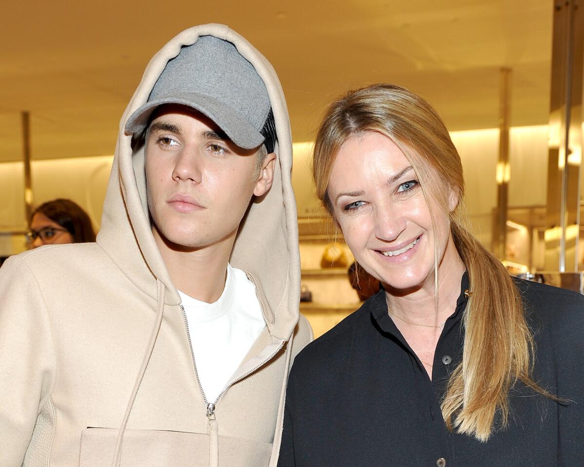 Singer Justin Bieber, left, with designer Anya Hindmarch at Barneys New York Beverly Hills on Oct. 15, 2015.
