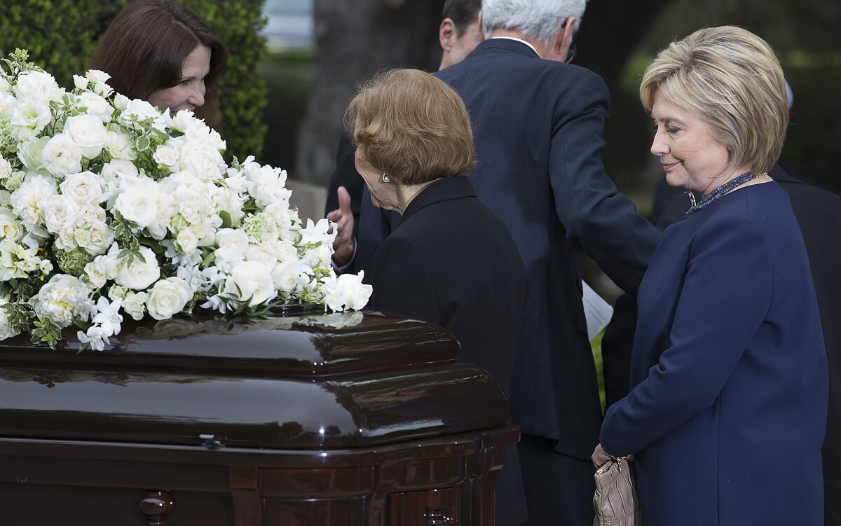 Hillary Clinton pauses before Nancy Reagan's casket at the former first lady's funeral in Simi Valley this month.