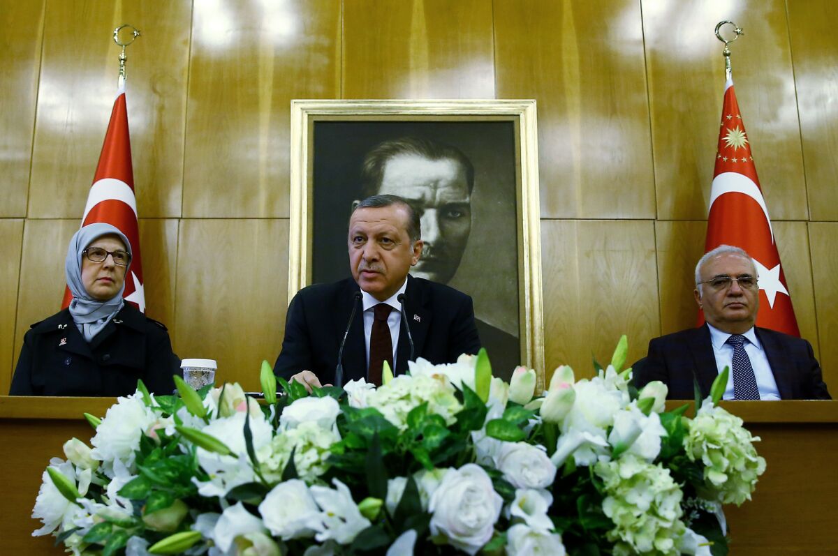 Diplomats say Turkish President Recep Tayyip Erdogan's (center) increasingly aggressive and undemocratic behavior in Turkey, plus what they describe as his mercurial role in the conflict in neighboring Syria, have diminished his standing in the Obama administration.