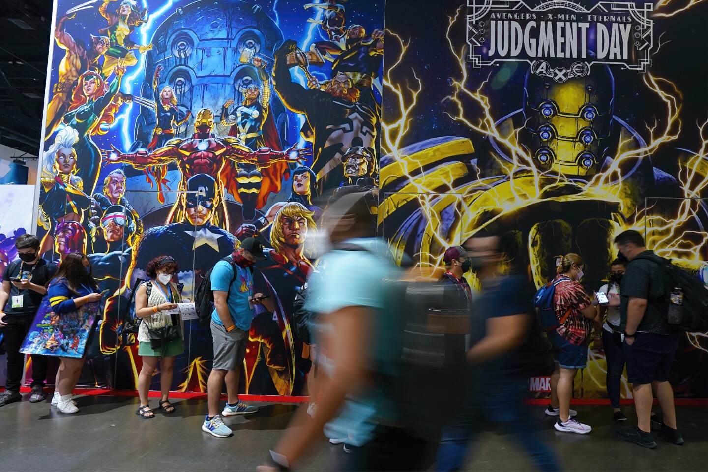San Diego, CA - July 20: At San Diego Convention Center on Wednesday, July 20, 2022 in San Diego, CA., several people wait in line to enter the Marvel retail booth, while others navigate the exhibit floor for Comic-Con 2022. (Nelvin C. Cepeda / The San Diego Union-Tribune)
