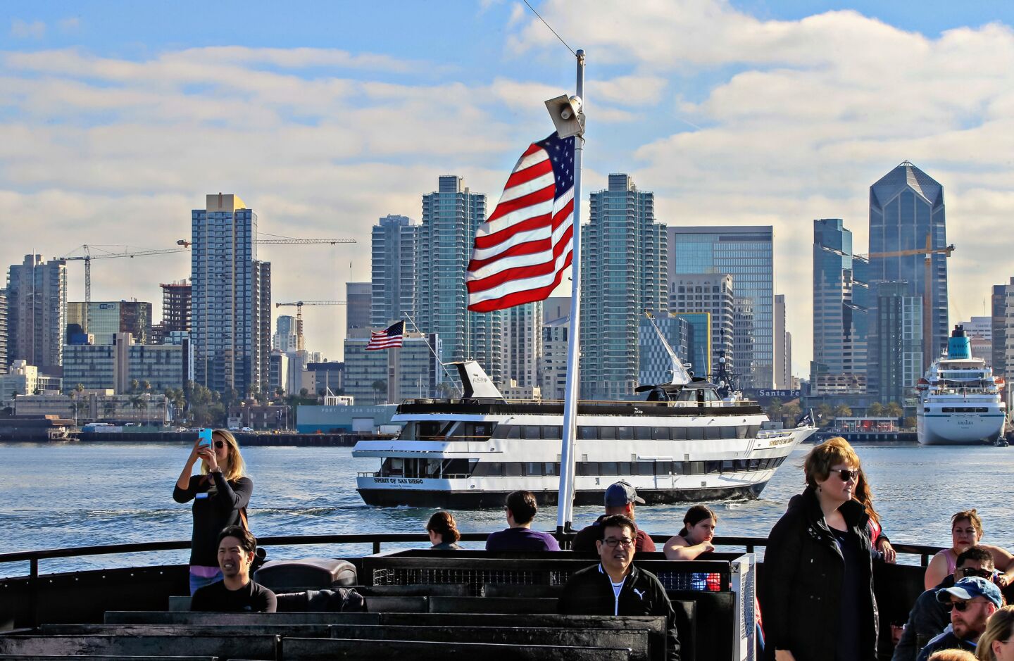 Passengers enjoy the skyline as they leave on a whale watching tour presented by Birch Aquarium and Flagship Cruises.