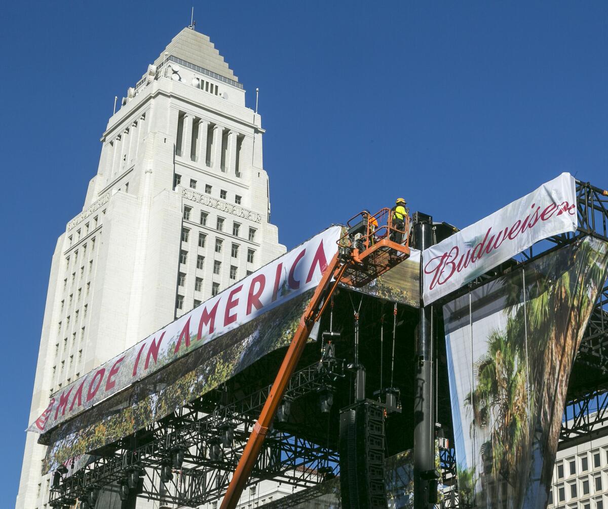 A stage for the Made in America festival is erected next to Los Angeles City Hall.