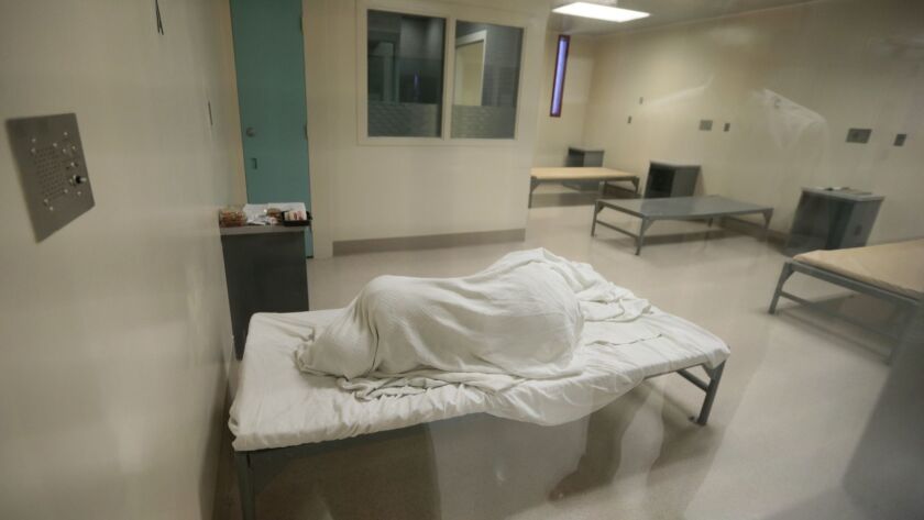An inmate sleeps in Los Angeles County's Twin Towers jail, which includes many inmates who need psychiatric care,