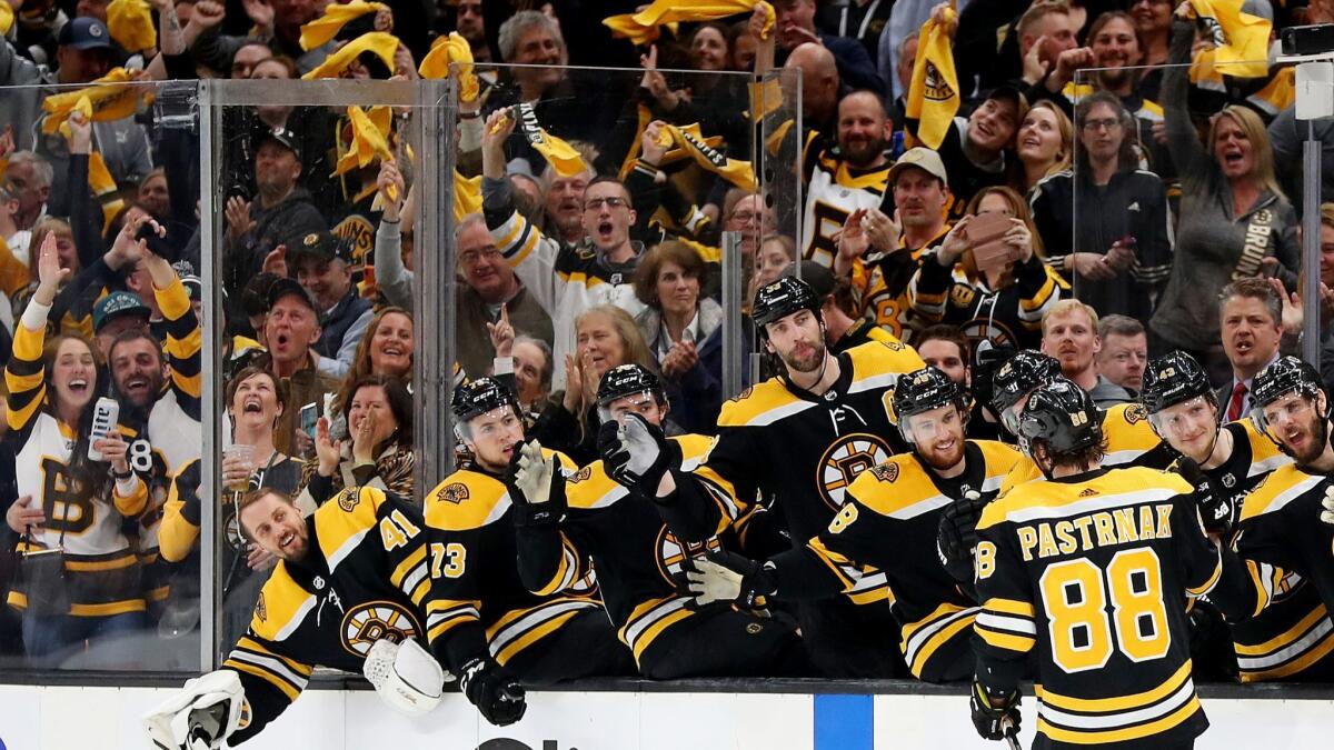 David Pastrnak (88) of the Boston Bruins celebrates with teammates after scoring a goal against the Columbus Blue Jackets during the third period.