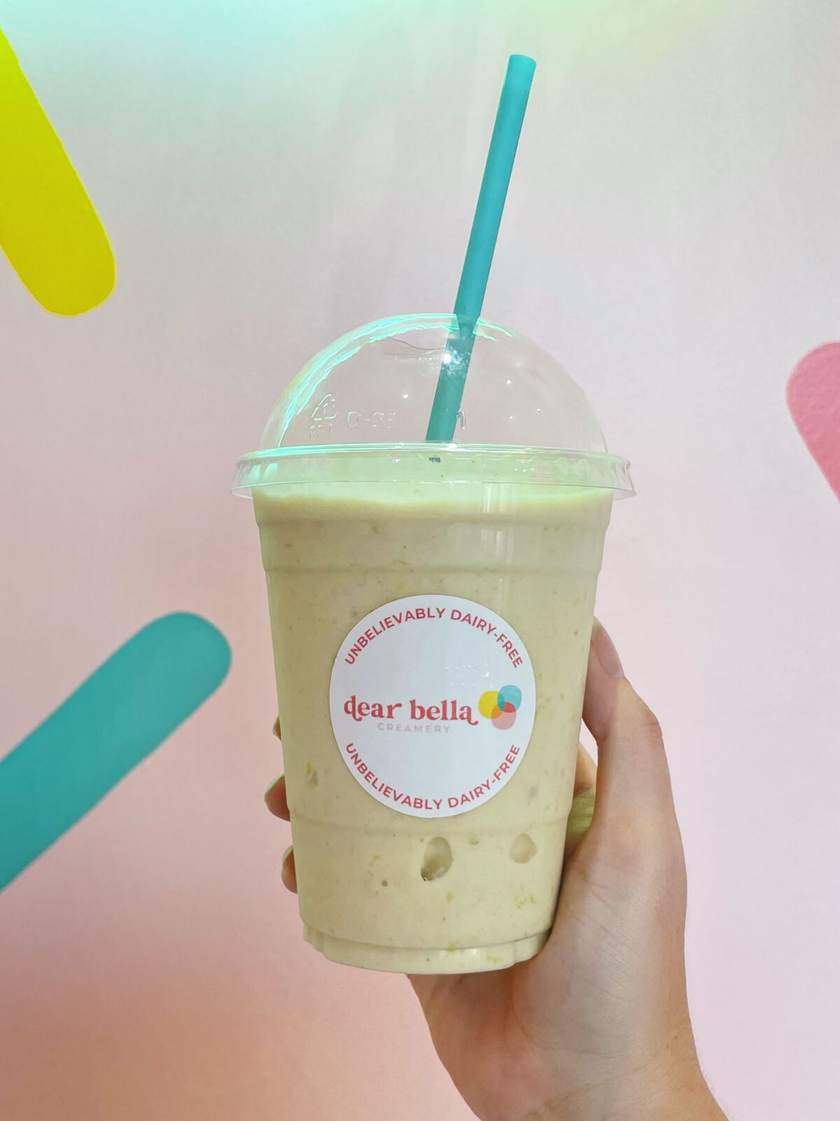 A Taiwanese pineapple cake shake against a light pink wall at Dear Bella Creamery in Los Angeles.