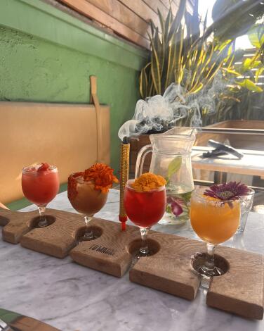 The standard margarita flight at Tu Madre includes tamarind, hibiscus, blood orange and passion fruit flavors.