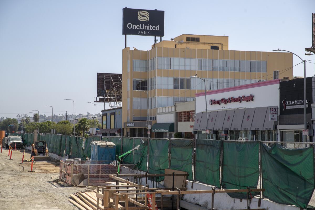 Developers of the District Square project informed the city in 2016 that construction of a light rail line on Crenshaw Boulevard had made it difficult for them to attract tenants to their project.