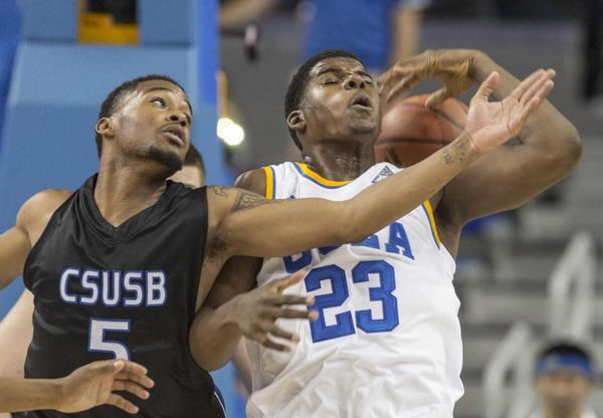 UCLA's Tony Parker, right, battles Cal State San Bernardino's Donte Medder for a loose ball during a preseason game last month. The Bruins will look to improve to 2-0 on the season Tuesday when they play Oakland.