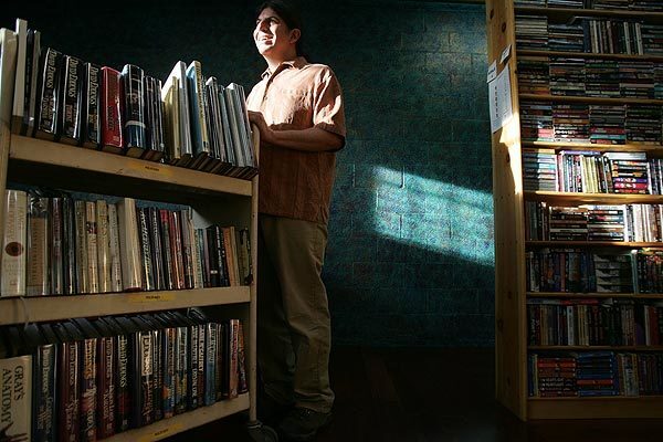 Dan Weinstein at his Iliad bookstore in North Hollywood. The shop, which specializes in used and specialty books, has been able to survive in an age of e-books, Amazon.com and big-box bookstores, thanks to a loyal following and its rare finds.