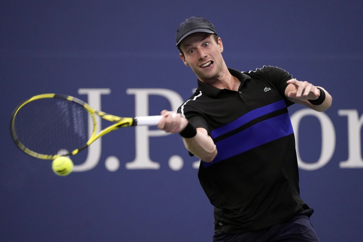 Botic Van de Zandschulp returns to Diego Schwartzman during the fourth round of the US Open.