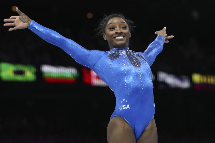 United States' Simone Biles celebrates winning the gold medal after her floor exercise.