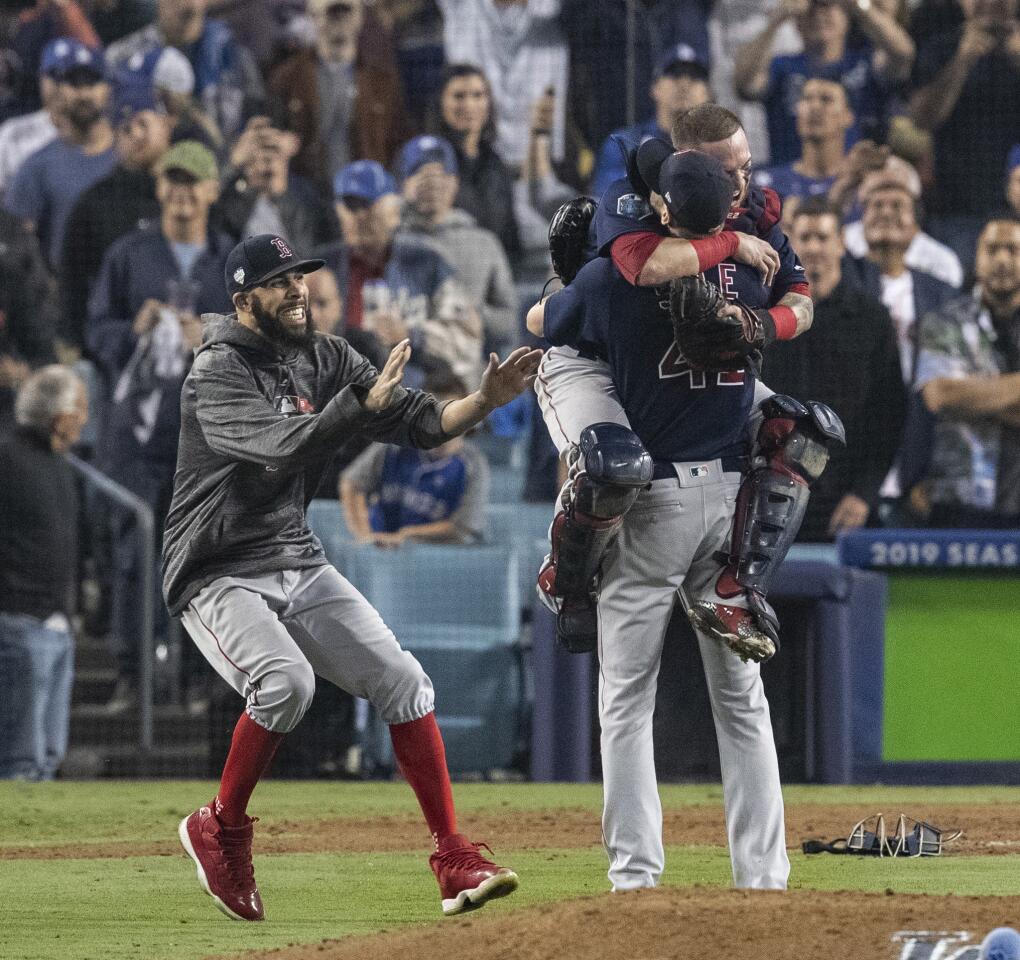 Red Sox starting pitcher David Price joins starter-turned-reliever Chris Sale and catcher Christian Vazquez in celebrating a 5-1 win over the Dodgers to clinch the World Series title.