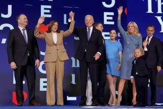 DNC CHICAGO, IL AUGUST 19, 2024 - Democratic presidential nominee Vice President Kamala Harris and President Joe Biden on stage with second gentleman Doug Emhoff, left, and first lady Jill Biden, right, during the 2024 Democratic National Convention in Chicago on Monday, August 19, 2024 in Chicago, IL. (Robert Gauthier/Los Angeles Times)