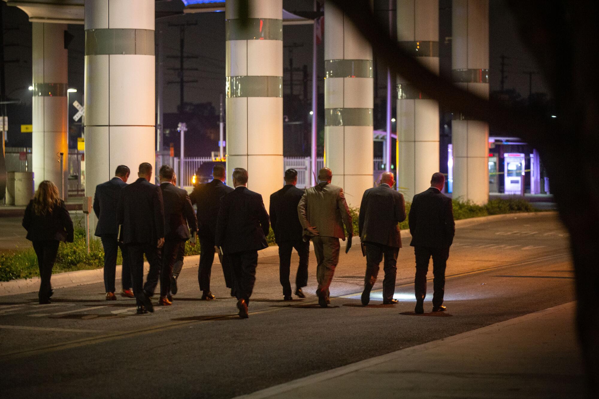 Detectives comb the area where two L.A. County sheriff's deputies were shot in Compton.