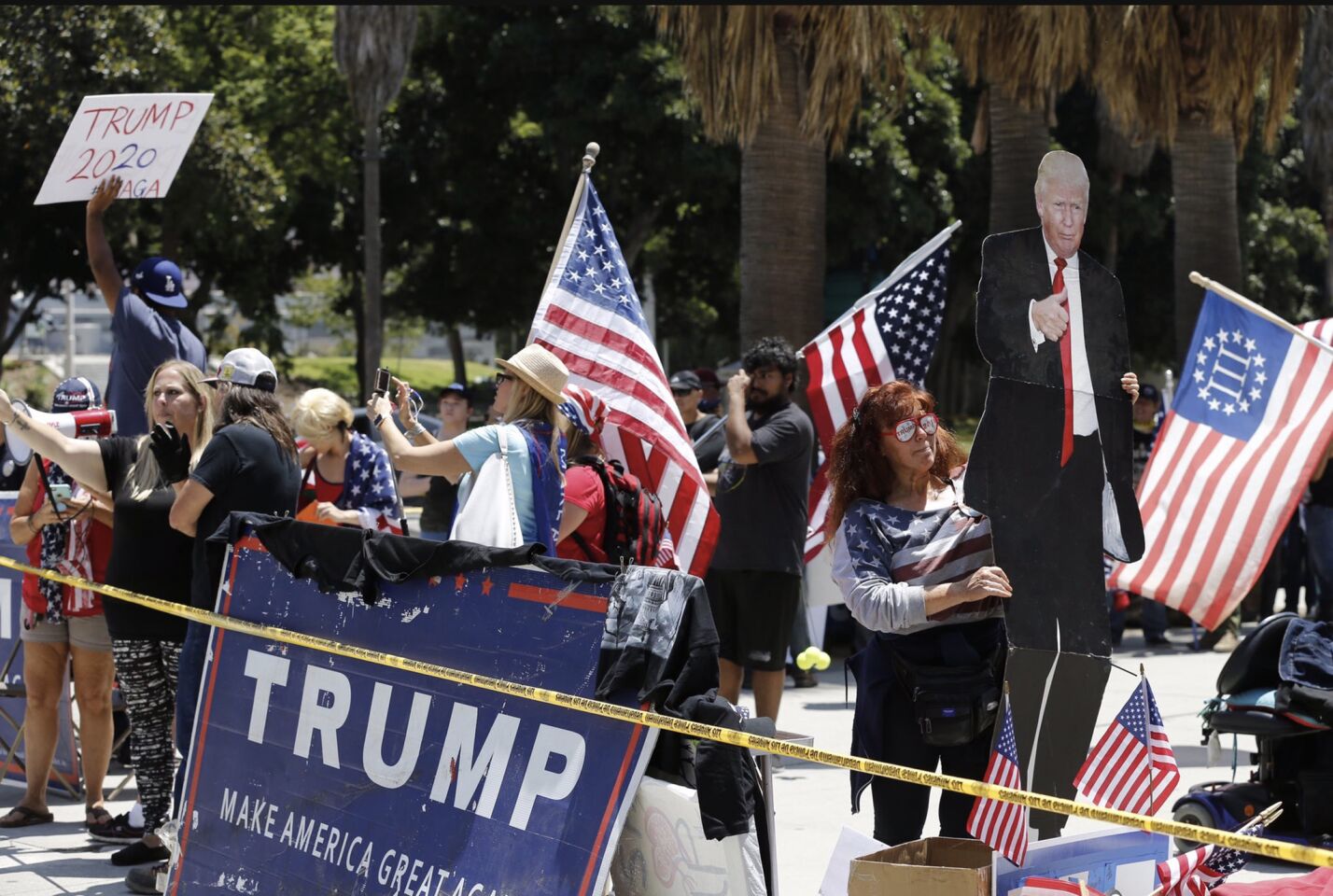 Supporters of the president gather near Los Angeles police headquarters at a small pro-Trump rally held as a counterprotest before and during the impeachment march.