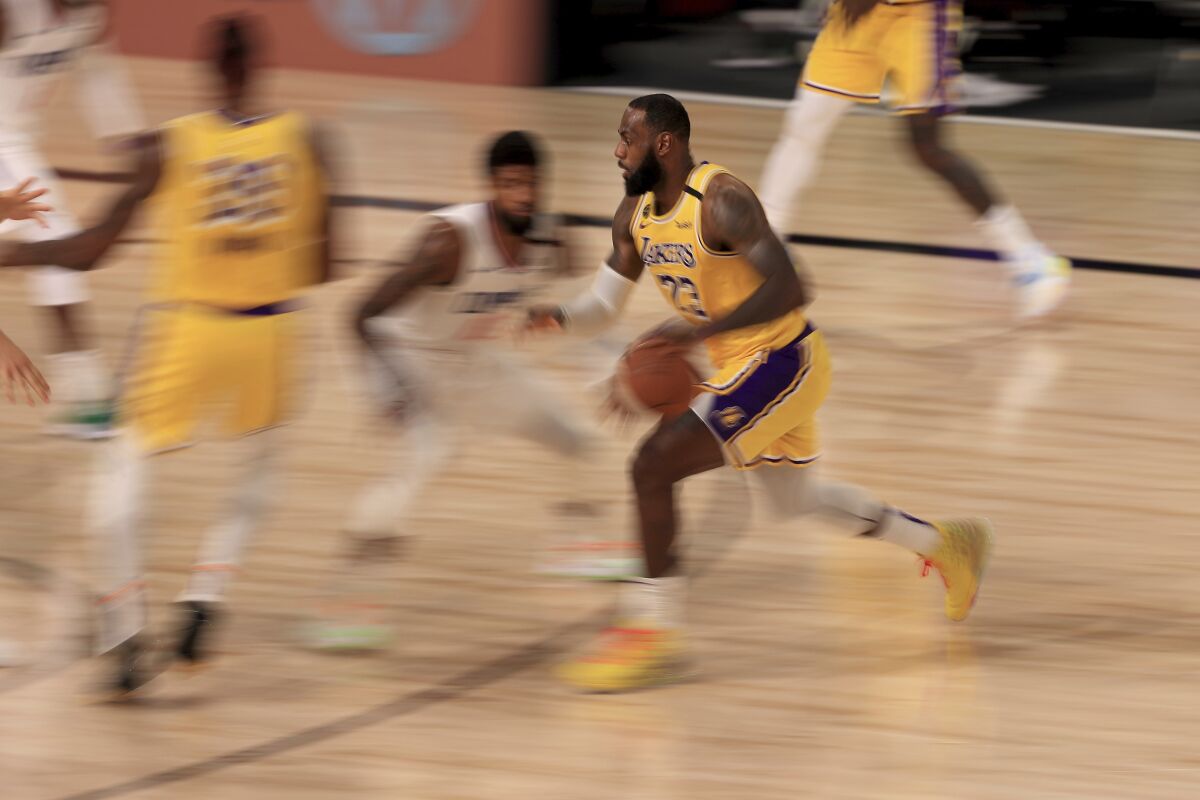 Lakers forward LeBron James drives to the basket.
