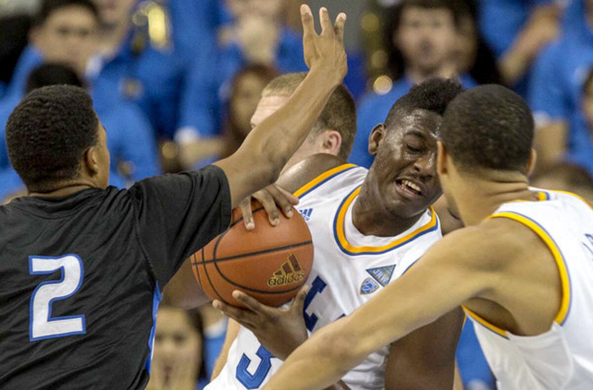 UCLA's Jordan Adams pulls down a rebound against Cal State San Bernardino during an exhibition game last week.
