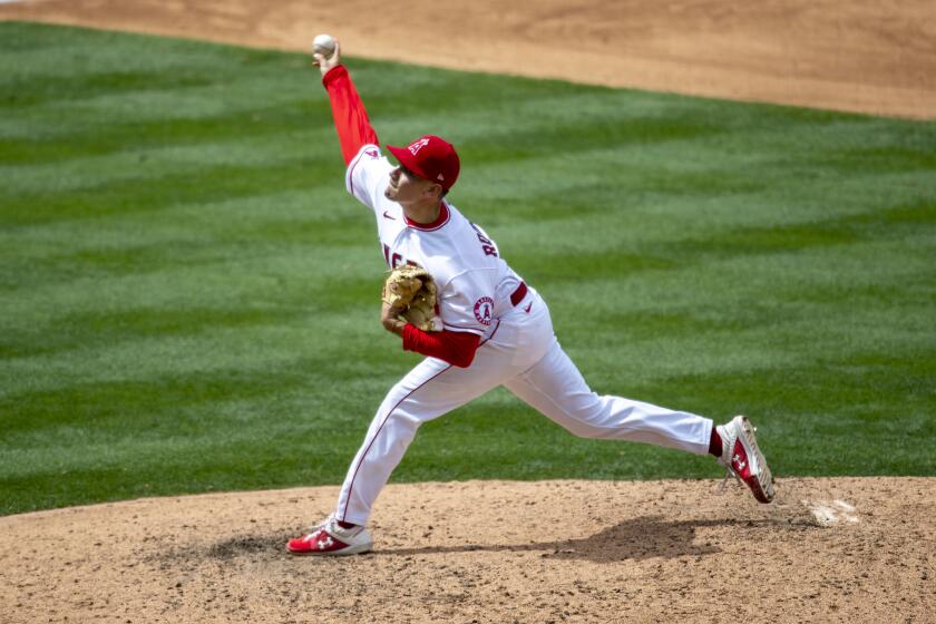 ANAHEIM, CA - APRIL 21, 2021: Los Angeles Angels pitcher Chris Rodriguez (73) pitches in relief against the Texas Rangers in the 6th inning at Angel Stadium on April 21, 2021 in Santa Ana California.(Gina Ferazzi / Los Angeles Times)