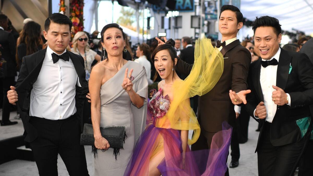 Director Jon M Chu (far right) and cast members from "Crazy Rich Asians" walk the red carpet at the 2019 Screen Actors Guild Awards. Thanks in large part to that film, the percentage of Asian females in speaking roles in was up from 7 percent in 2017 to 10 percent in 2018.