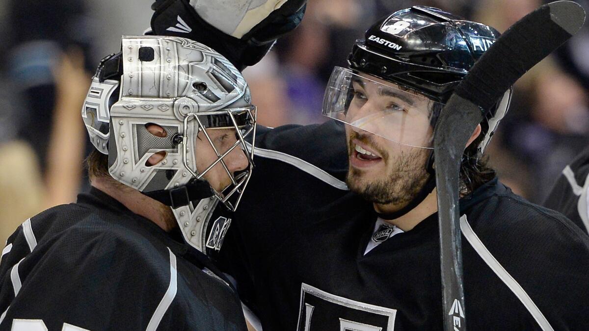 Kings defenseman Drew Doughty, right, congratulates goalie Jonathan Quick after the team's 4-1 win over the San Jose Sharks in Game 6 of the Western Conference quarterfinals Monday. Doughty says the Kings can treat Wednesday's Game 7 as "the Stanley Cup Final."