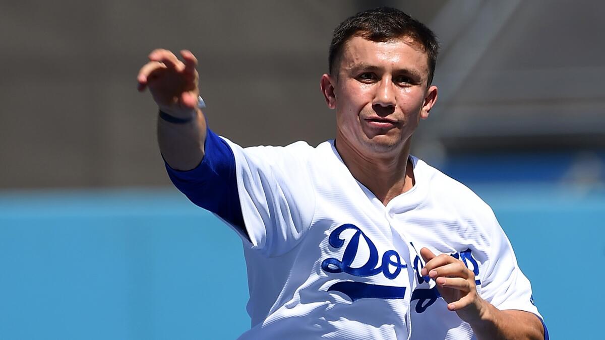 Boxing champion Gennady Golovkin throws out the ceremonial first pitch before the Dodgers' game against the Colorado Rockies on Sunday.