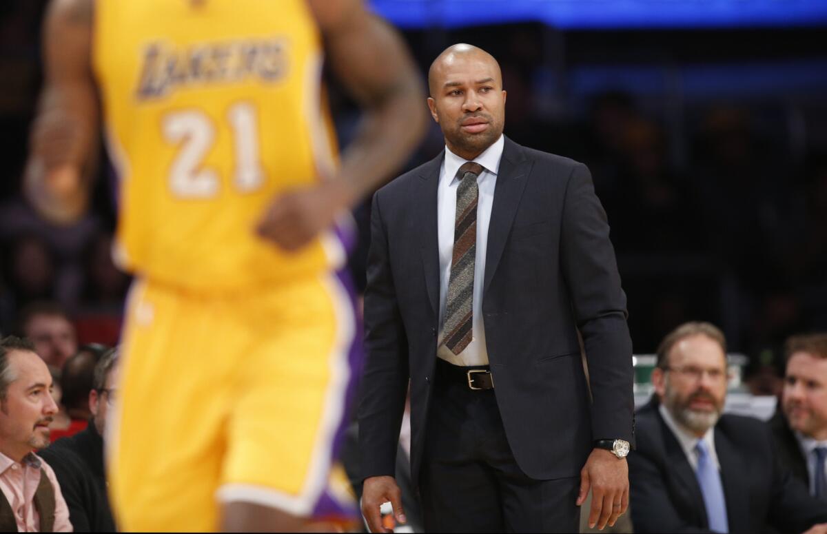 Knicks Coach Derek Fisher watches his team battle against the Lakers, a team he won an NBA championship with.